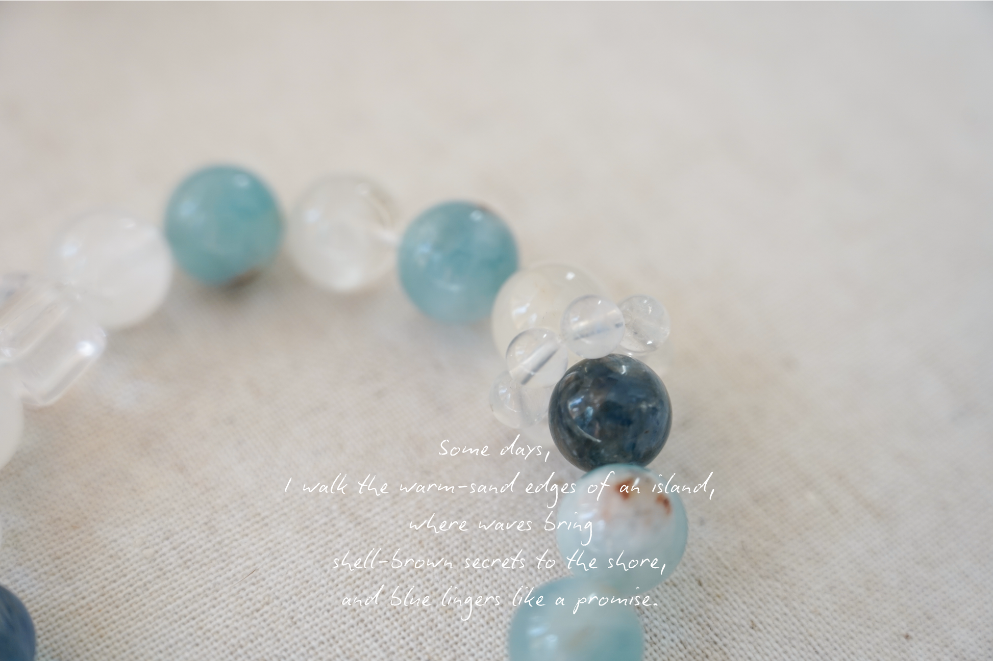 Beaded crystal bracelet with blue and clear beads on a light background