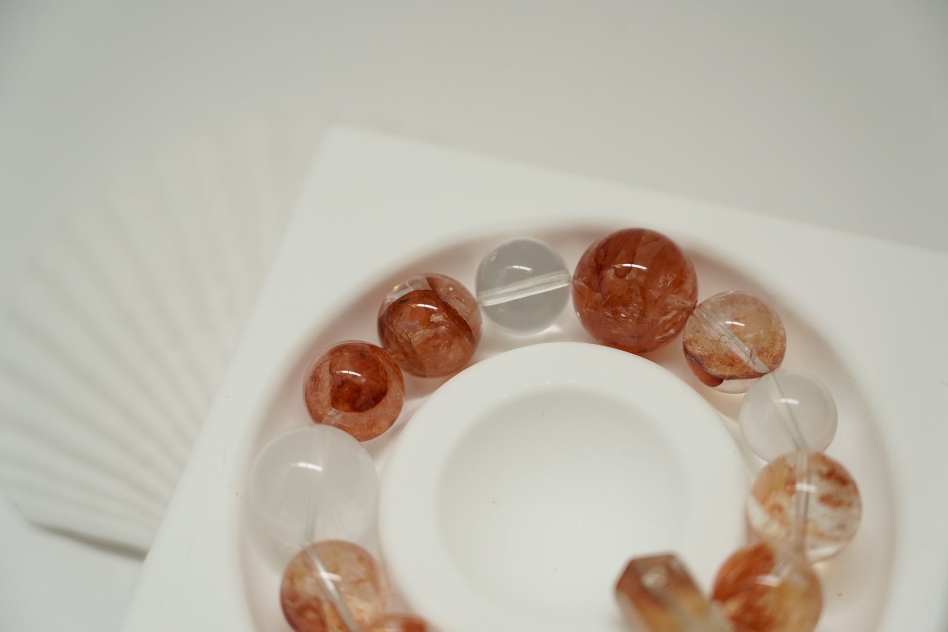 Amber Dawn Crystal Bracelet with brown and clear beads on a white surface